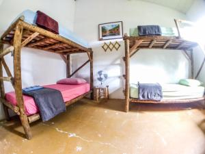 two bunk beds in a flooded room with water at Hospeda Vila in Vale do Capao