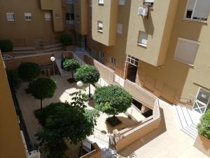 an overhead view of a building with trees in a courtyard at APplaya in El Puerto de Santa María