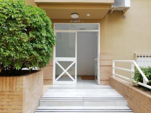 a glass door leading to a house at APplaya in El Puerto de Santa María +6 photos