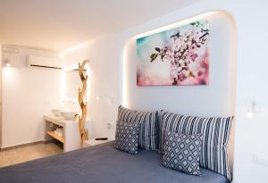 A bed or beds in a room at Mina Studios