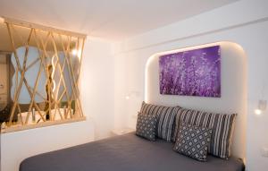 A bed or beds in a room at Mina Studios