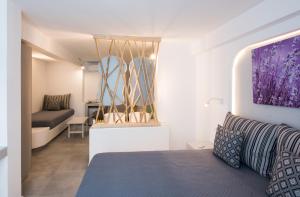 A bed or beds in a room at Mina Studios