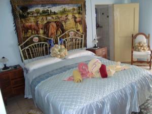 Ein Bett oder Betten in einem Zimmer der Unterkunft B&B Masseria SD di Manchisi