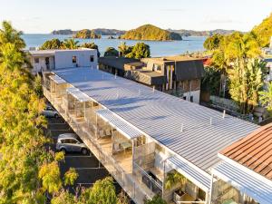 an aerial view of a building with a parking lot at Sea Spray Suites - Heritage Collection in Paihia