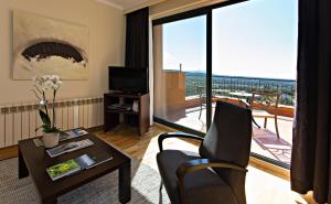 TV a/nebo společenská místnost v ubytování Hotel Can Xiquet