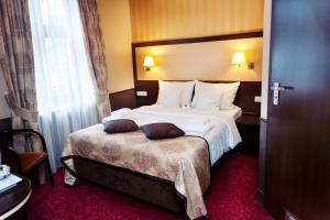 Posteľ alebo postele v izbe v ubytovaní Hotel Wielopole
