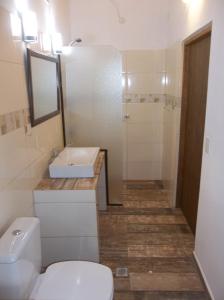 a bathroom with a white toilet and a sink at Holidayhome Buena Vista in Trinidad