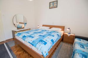 Posteľ alebo postele v izbe v ubytovaní Apartments Josip by the sea