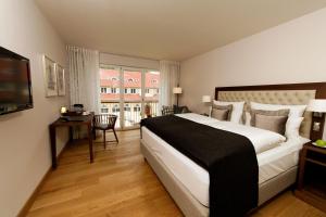 Letto o letti in una camera di Waldhotel Stuttgart