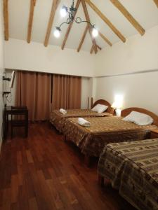 Ένα ή περισσότερα κρεβάτια σε δωμάτιο στο Qali Samanawasi