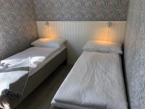 Katil atau katil-katil dalam bilik di Helsingegården