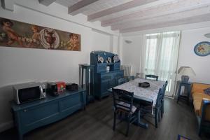 a living room with a table and a tv at Angels'Home in Pizzo