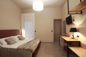 Postel nebo postele na pokoji v ubytování Hotel Aloisi
