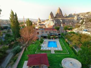 an aerial view of a mansion with a swimming pool at Kufe Hotel in Goreme