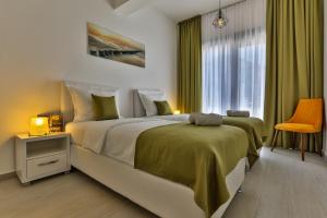 Postel nebo postele na pokoji v ubytování Apart Hotel Sea Fort