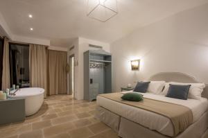 A bed or beds in a room at Romantic Relais Sorrento