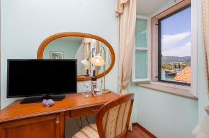 TV a/nebo společenská místnost v ubytování Hotel Ostrea