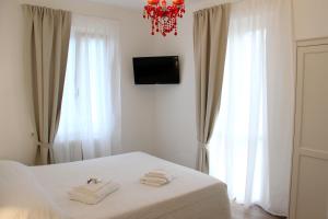 A bed or beds in a room at Casa Maiò