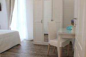 A bed or beds in a room at Casa Maiò