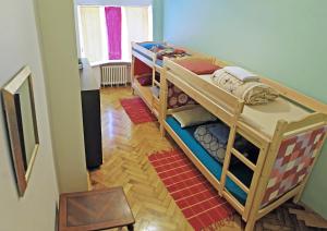 two bunk beds in a room with a hallway at The Monk's Bunk Kaunas in Kaunas