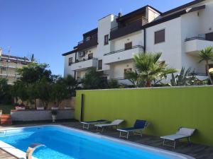 a swimming pool in front of a building at Casa Vacanze Domusangela in Matera