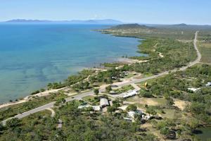 an aerial view of the shoreline of a lake at Ocean View Motel Bowen in Bowen