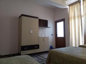 Postel nebo postele na pokoji v ubytování Hotel Gjeli