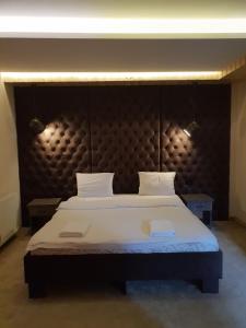 Un pat sau paturi într-o cameră la Villa Grazia