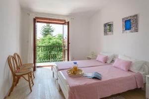 Ένα ή περισσότερα κρεβάτια σε δωμάτιο στο Accomodation TERRAROSSA