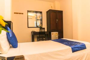 Postel nebo postele na pokoji v ubytování Blue Star Hotel