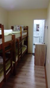 a room with four bunk beds and a hallway at Hostel „Ж" in Gradsko