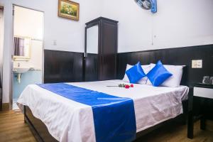 Postel nebo postele na pokoji v ubytování Blue Star Hotel