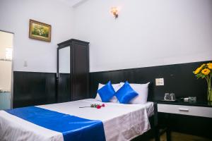 Postel nebo postele na pokoji v ubytování Blue Star Hotel