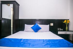 Postel nebo postele na pokoji v ubytování Blue Star Hotel