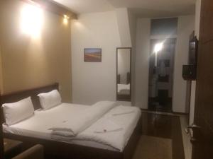 Postel nebo postele na pokoji v ubytování Hotel Millenium2