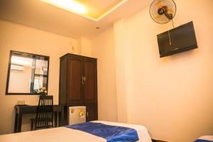Postel nebo postele na pokoji v ubytování Blue Star Hotel