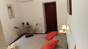 Posteľ alebo postele v izbe v ubytovaní A casa di Lori