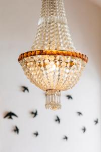 a chandelier hanging from a ceiling at Sintra1012 Boutique Guesthouse in Sintra