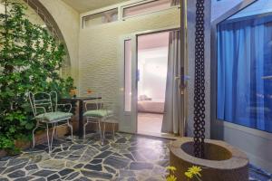 a room with a door and a table and chairs at Villa Vicko in Starigrad