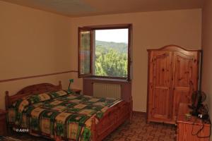 Postel nebo postele na pokoji v ubytování Agriturismo La Praduscella