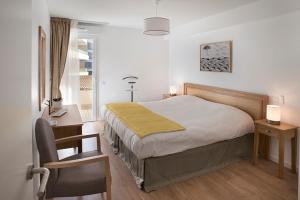 Ένα ή περισσότερα κρεβάτια σε δωμάτιο στο Domitys Le Sextant