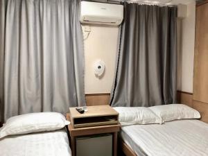 Postel nebo postele na pokoji v ubytování Good Fortune Inn