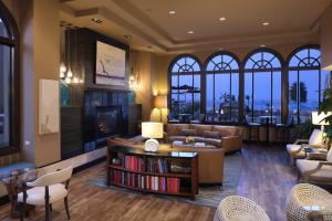 a living room with a couch and a fireplace at The Cliffs Hotel and Spa in Pismo Beach