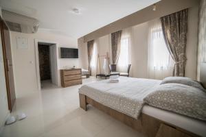Postel nebo postele na pokoji v ubytování Hotel Urban