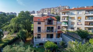 an apartment building in a city with buildings at Apartment Anai Rijeka in Rijeka