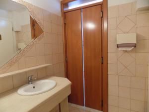 a bathroom with a sink and a glass shower at Estia hotel in Fourka +73 photos