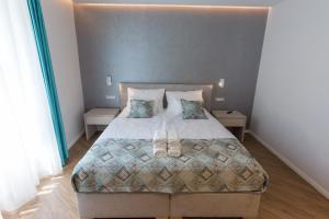 Posteľ alebo postele v izbe v ubytovaní AML apartments