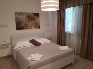 Postel nebo postele na pokoji v ubytování Villa Zoe