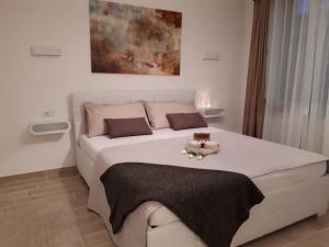 Postel nebo postele na pokoji v ubytování Villa Zoe