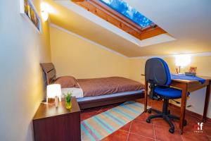a bedroom with a bed and a desk and a chair at Apartment Anai Rijeka in Rijeka +51 photos